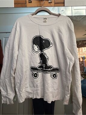 KAWS White Crewneck Sweatshirt with Black Snoopy Skate Graphic - Men
